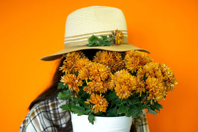 High angle view of hat on yellow background