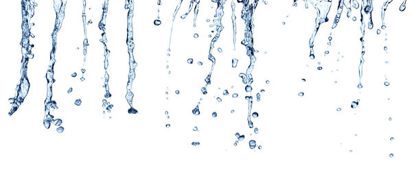 Close-up of water drops on glass against white background