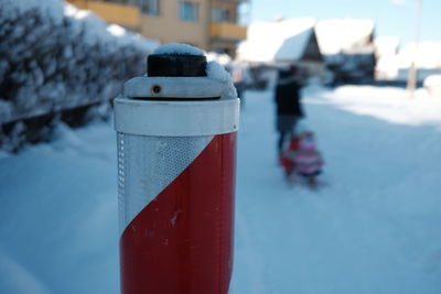 Close-up of ice cream cone in snow