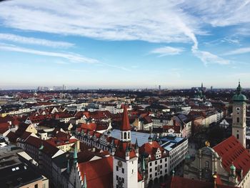 Cityscape against cloudy sky