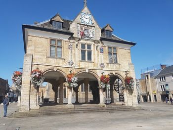 Low angle view of historical building against blue sky