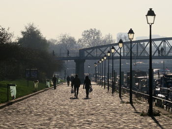 People walking on footpath during winter