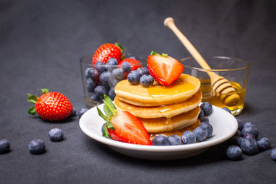 Close-up of fruits in plate on table
