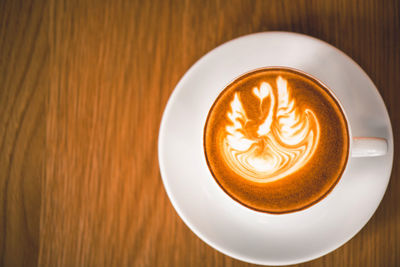 Close-up of cappuccino on table