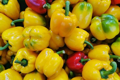 Full frame shot of yellow bell peppers for sale in market