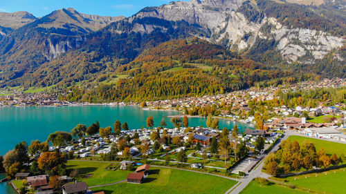 High angle view of lake by buildings in city