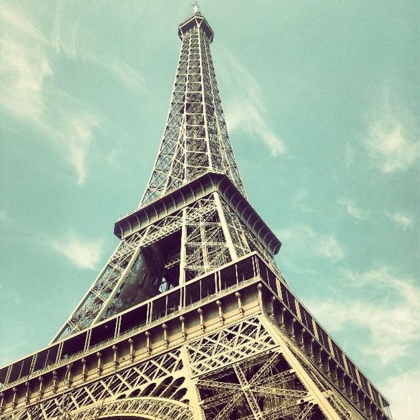 eiffel tower, low angle view, architecture, built structure, tower, tall - high, metal, sky, famous place, culture, international landmark, metallic, travel destinations, tourism, capital cities, travel, architectural feature, history, tall, day