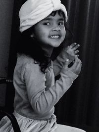 Portrait of smiling girl standing at home