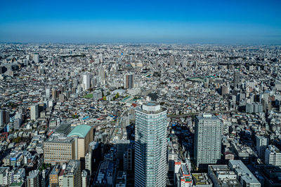 Aerial view of cityscape against sky