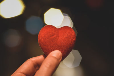 Close-up of hand holding heart shape