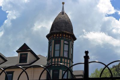 Low angle view of historical building against cloudy sky