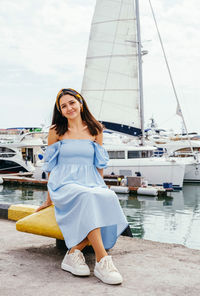 Woman standing in a harbor