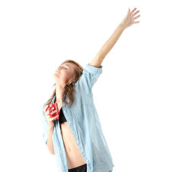 Young woman standing against white background
