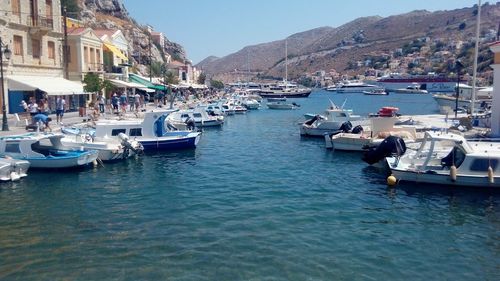 Boats moored at harbor