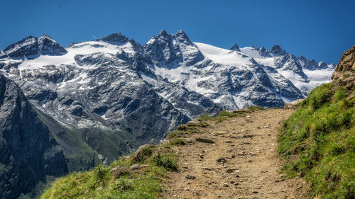 Scenic view of snowcapped mountains against sky