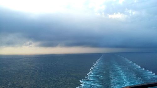 Scenic view of sea against cloudy sky