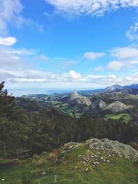 Scenic view of landscape against cloudy sky