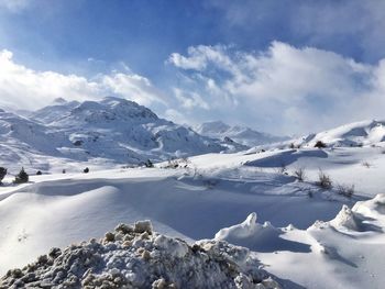 Scenic view of snowcapped mountains against sky