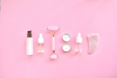 Close-up of pink bottles on table