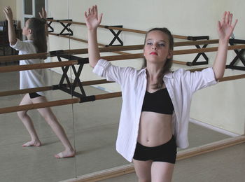 High angle view of ballerina practicing in dance studio