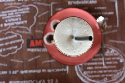 Directly above shot of coffee cup on table