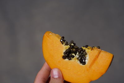 Close-up of hand holding fruit