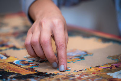 Close-up of hands on table