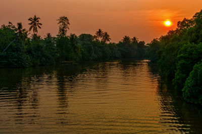 Scenic view of lake against sky during sunset