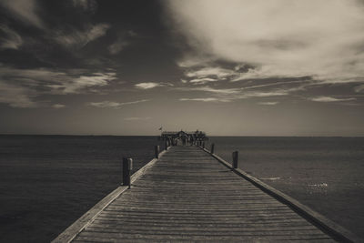 Pier over sea against sky