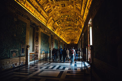 People in corridor of building