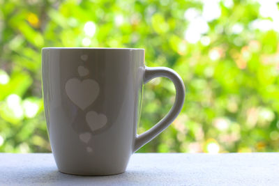 Close-up of coffee cup on table