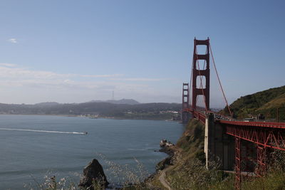 View of suspension bridge over sea