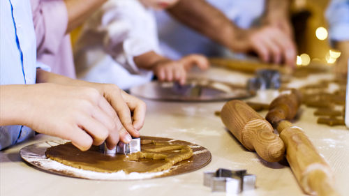 Close-up of man preparing food in kitchen