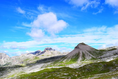 View of volcanic landscape against cloudy sky