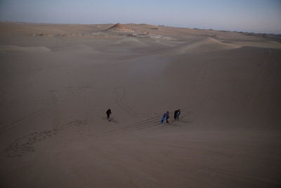 People riding in desert