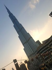 Low angle view of buildings against sky during sunset