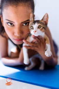 Portrait of woman with cat