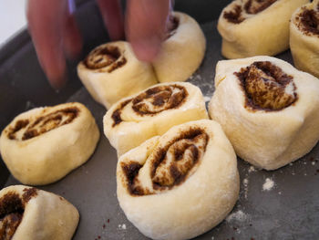 Close-up of person preparing cookies