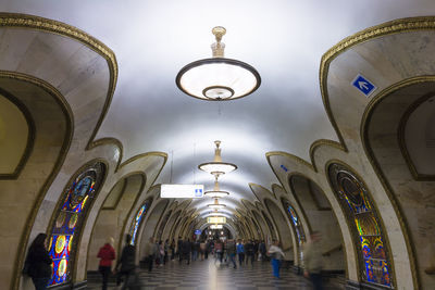 People in illuminated building