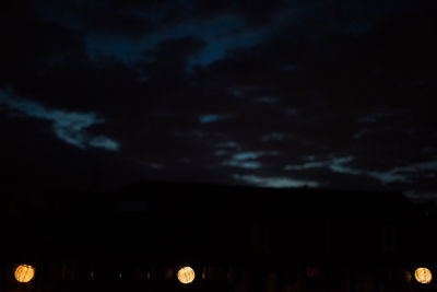 Low angle view of silhouette moon against sky at night