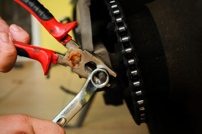 High angle view of man working on metal