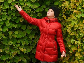 Young woman standing on plant