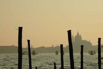 Scenic view of sea against clear sky during sunset