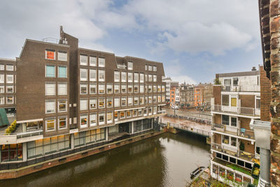 Buildings in city against sky