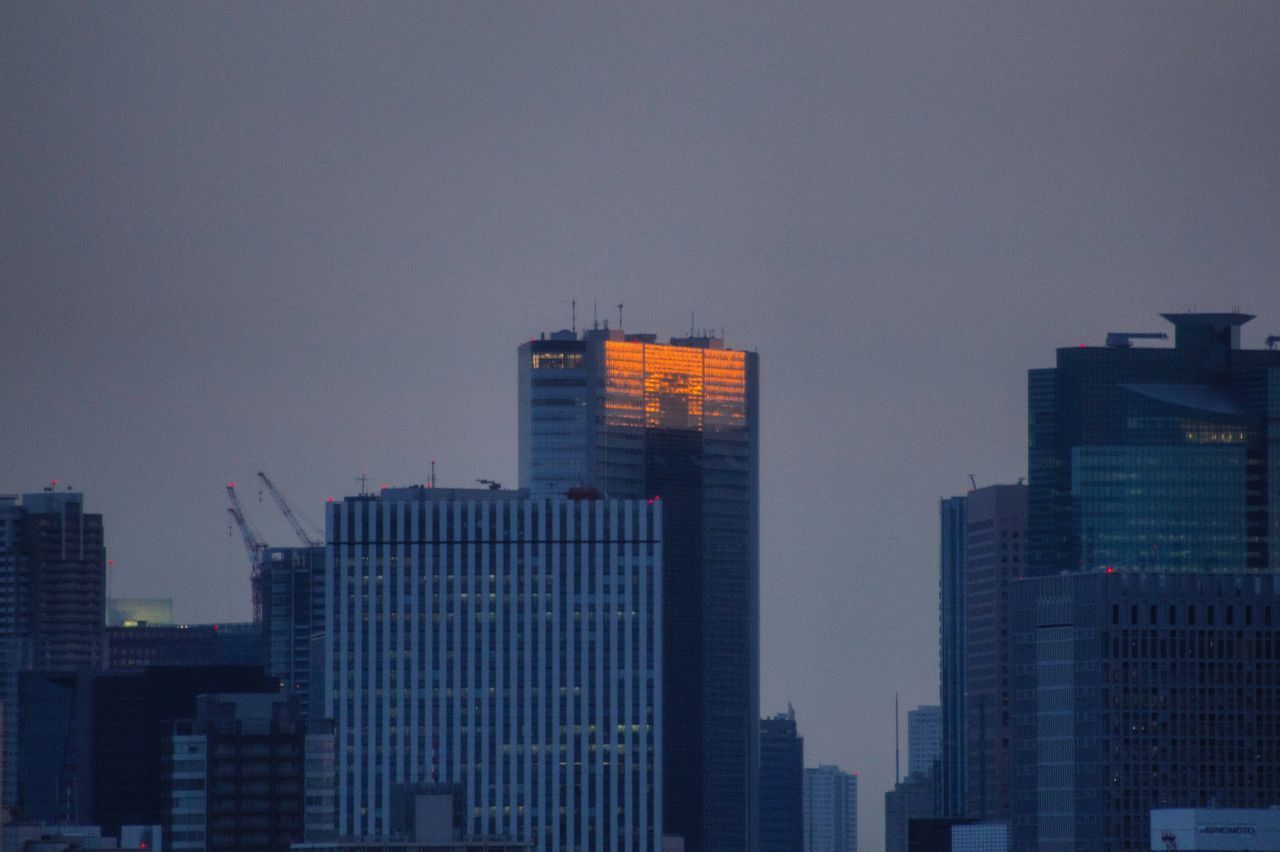 SKYSCRAPERS IN CITY AGAINST SKY