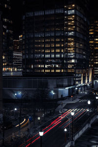 High angle view of illuminated city buildings at night