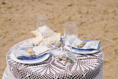 Serving a romantic dinner for newlyweds in love by the sea or ocean on their honeymoon