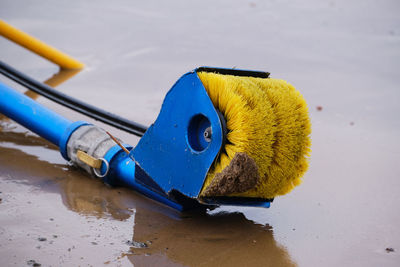 High angle view of yellow toy on beach