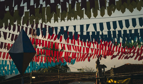 Multi colored flags hanging on clothesline