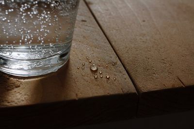 Close-up of wet glass on table